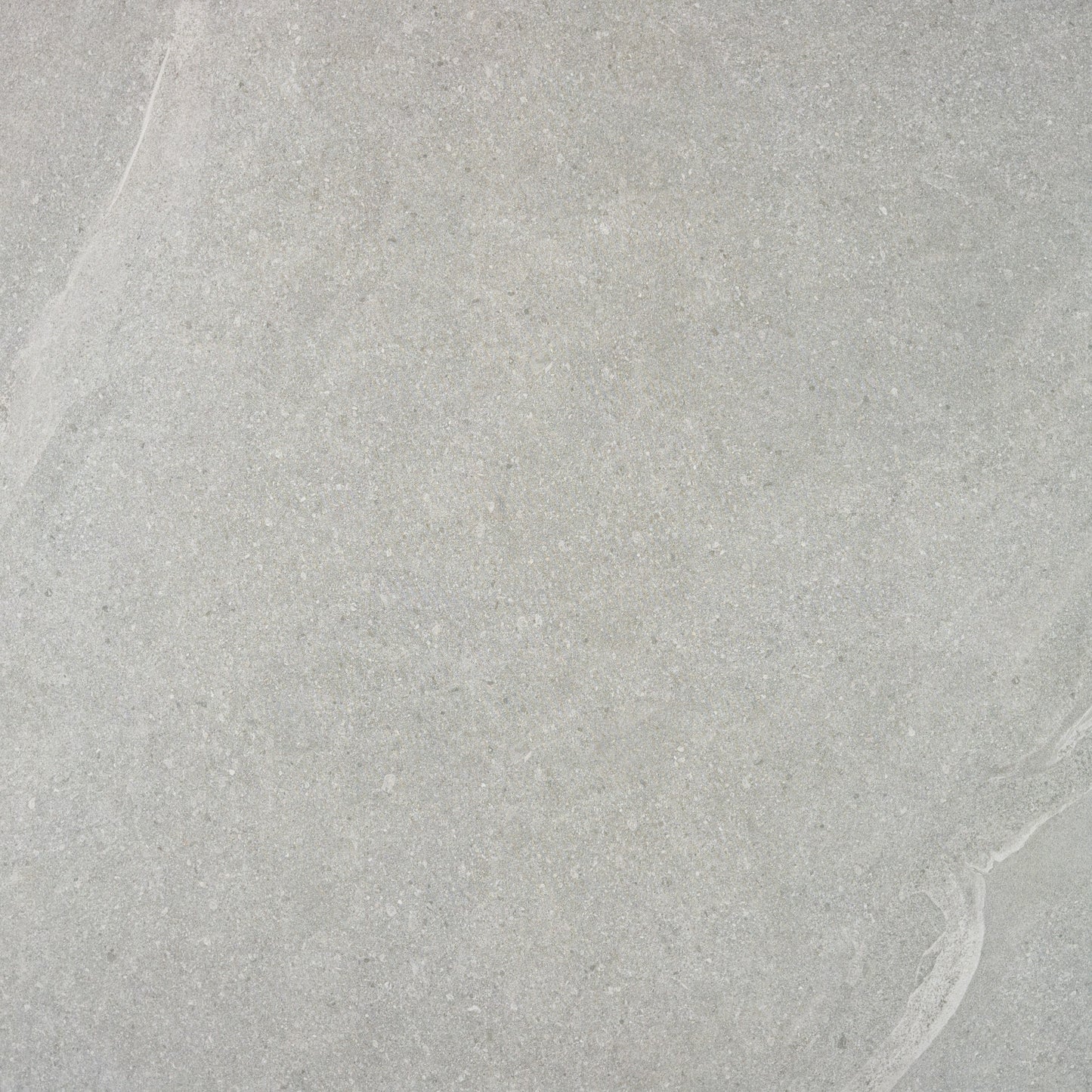 Light gray Ashmore Grey Porcelain Slabs feature subtle, natural veining and a slightly textured appearance. Their uniform, smooth pattern makes these outdoor porcelain tiles ideal for stylish, slip-resistant paving slabs in modern spaces.
