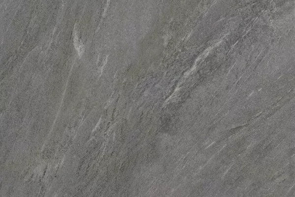 Gray stone surface with subtle white and darker gray veining, showing a natural, textured pattern typical of slate or granite—ideal for outdoor porcelain tiles like Fraser Anthracite Porcelain Paving Slabs.