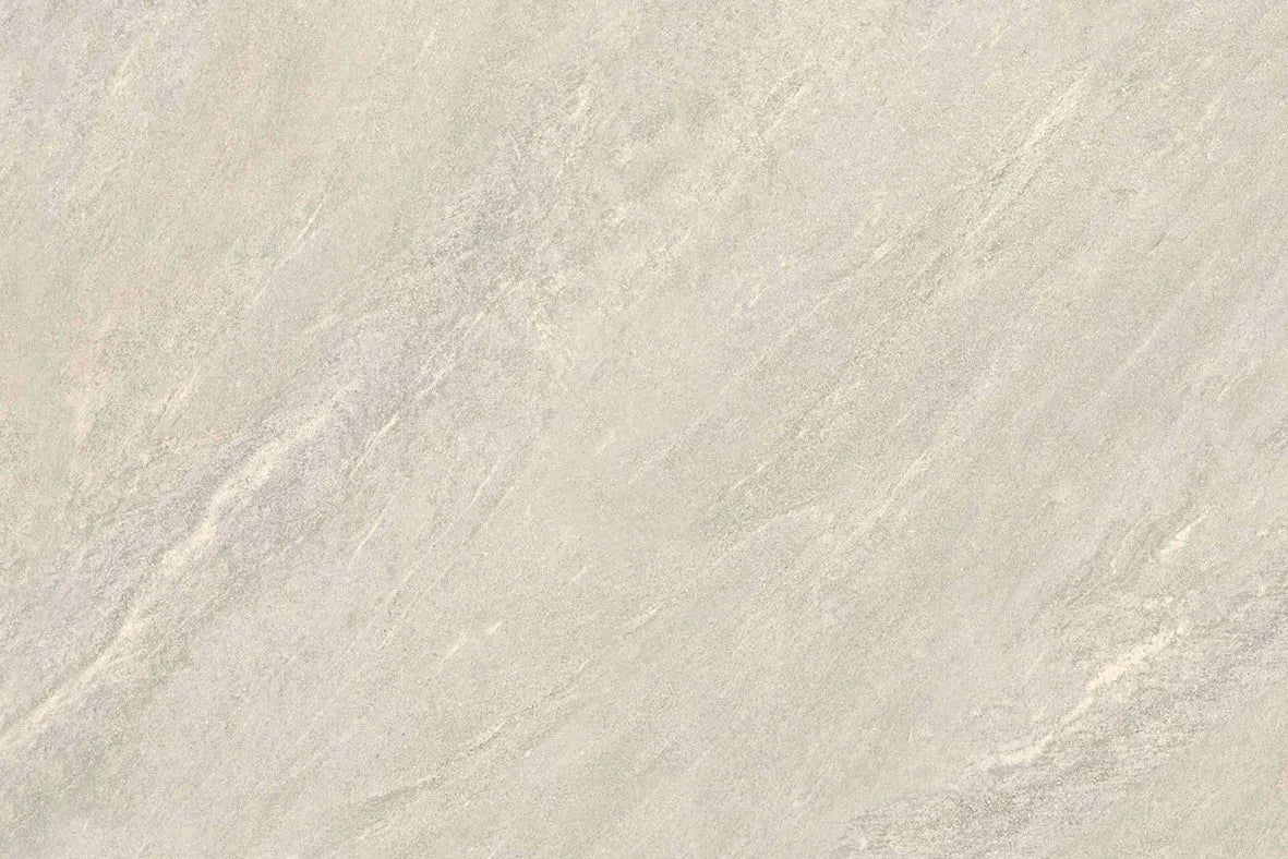 Light gray textured stone surface with subtle fine lines and natural patterns, these Fraser Bianco Porcelain Paving Slabs offer a smooth, slightly marbled appearance perfect for contemporary outdoor spaces.