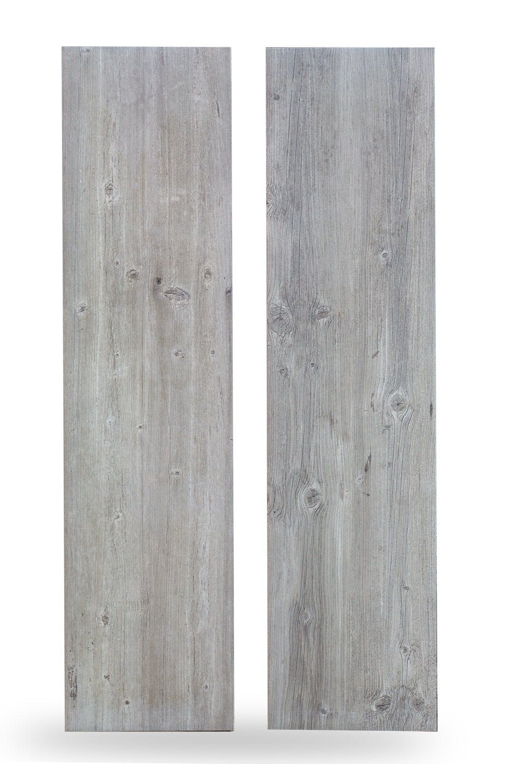 Two rectangular wood look porcelain tiles with a light gray, weathered finish and visible wood grain patterns, knots, and subtle texture, standing upright against a white background.