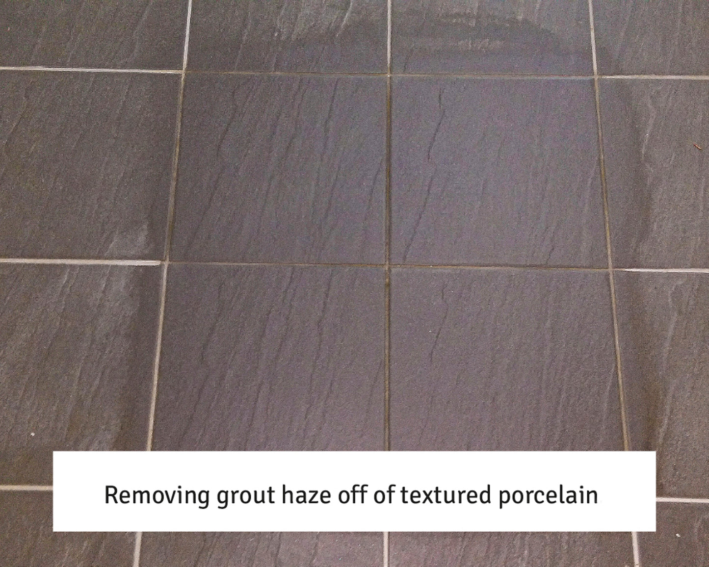 A close-up of dark textured porcelain tiles with visible grout haze. Text overlay reads: "Removing grout haze off of textured porcelain using a grout residue remover.