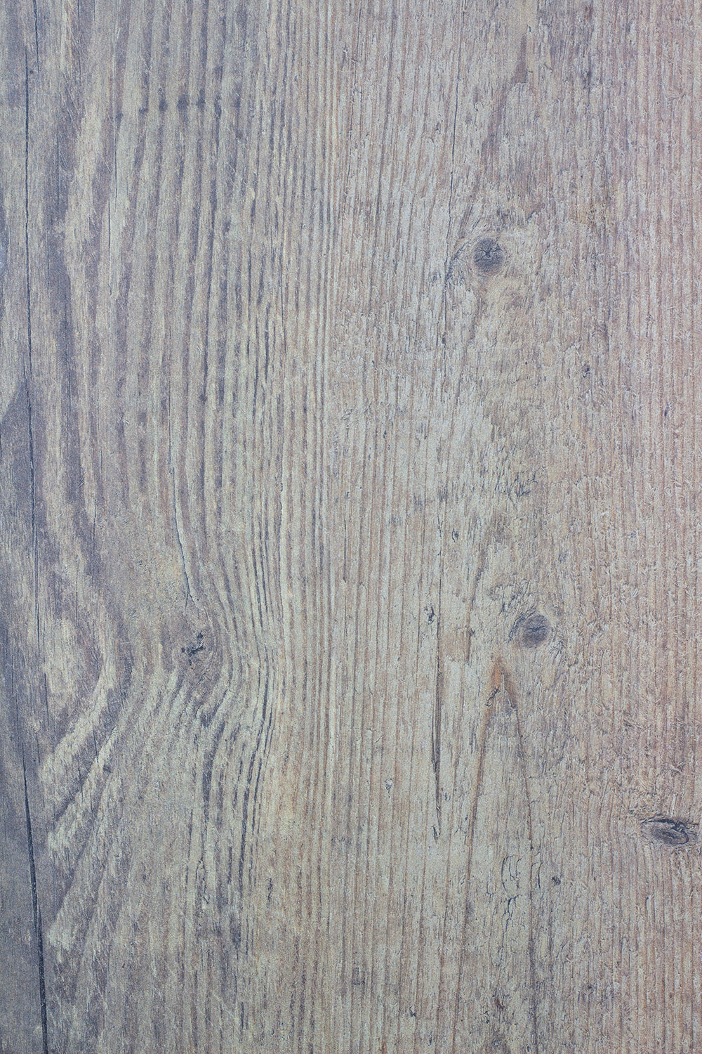 Close-up of a light brown wooden surface with visible grain patterns, knots, and subtle texture variations, capturing a natural wood appearance running vertically across the image.