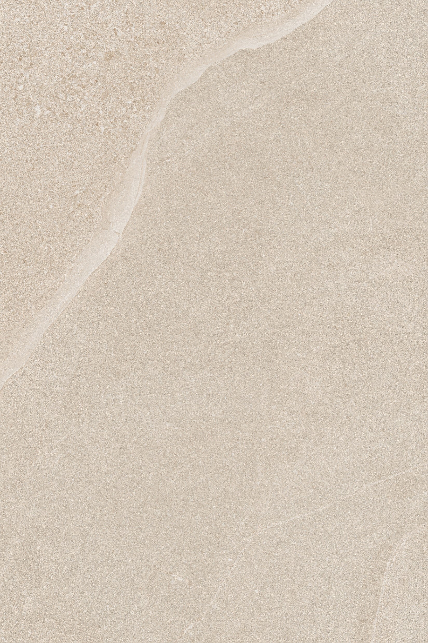 A close-up of Ashmore Ivory Porcelain Paving Slabs showcases a beige surface with subtle variations in texture and color, featuring smooth areas and a slightly rough, natural pattern along the top edge.