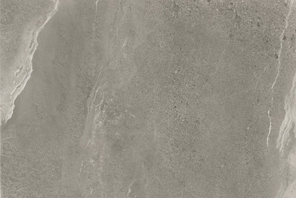 Gray stone surface with subtle variations in texture and color, featuring wavy, natural patterns and fine speckling throughout. Ideal for grey outdoor tiles or porcelain paving, this finish offers the look of polished marble with slip resistant qualities.