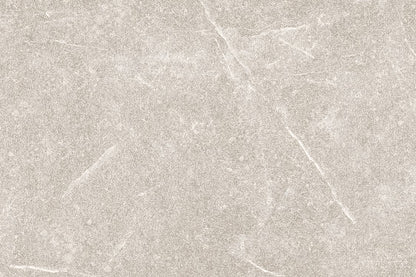 A textured light gray stone surface with faint white veins and subtle cracks, Brampton Perla Porcelain tiles offer a natural, weathered appearance—ideal for stylish outdoor porcelain tiles that blend elegance with durability.