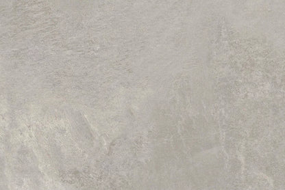 Light gray textured stone surface with subtle variations in tone and natural patterning, Fraser Grigio Porcelain Paving Slabs offer a modern look that resembles concrete or slate.