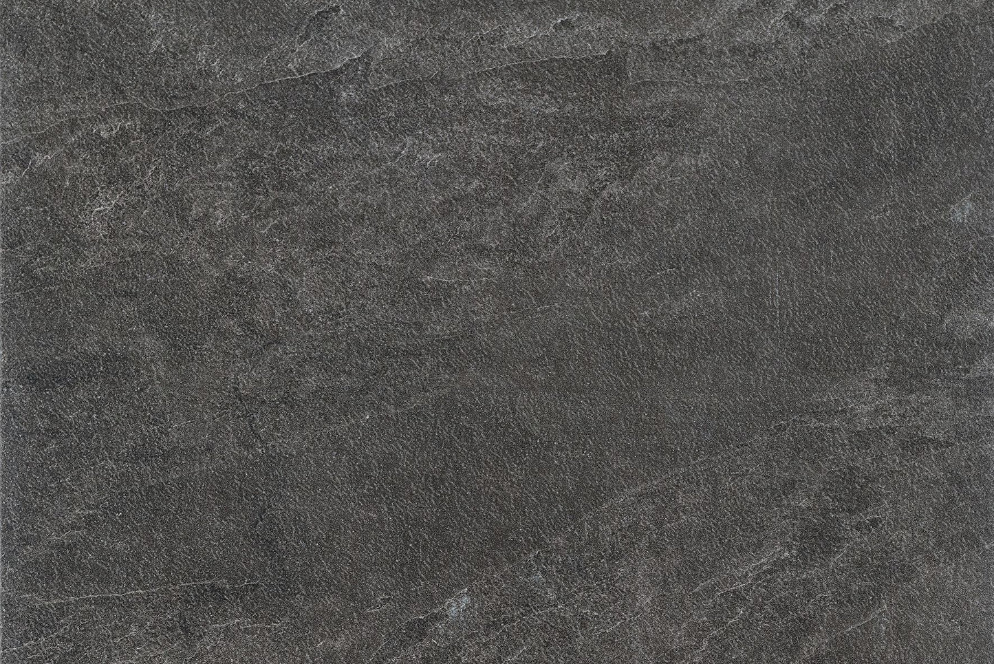 A close-up view of a dark gray stone surface with subtle variations in texture and faint, natural-looking lines—ideal for outdoor paving tiles that offer both durability and aesthetic appeal.
