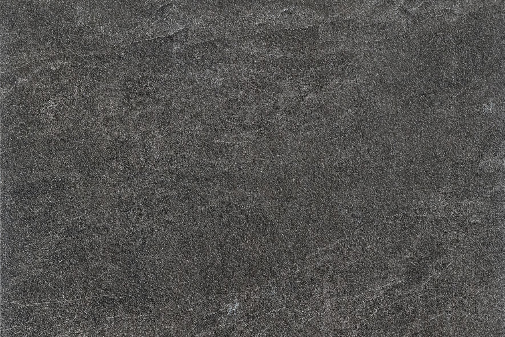 A close-up view of a dark gray stone surface with subtle variations in texture and faint, natural-looking lines—ideal for outdoor paving tiles that offer both durability and aesthetic appeal.