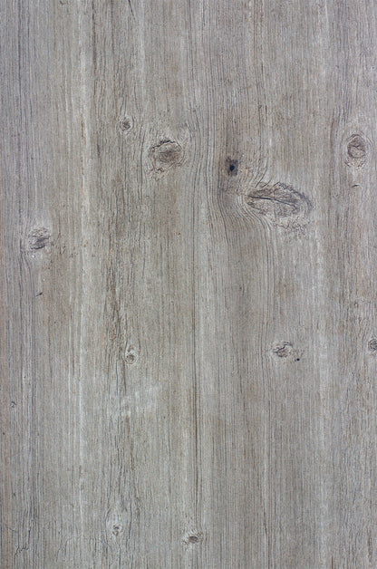 Light brown wood look porcelain tile with visible grain patterns and natural knots, showcasing a rustic and textured appearance.