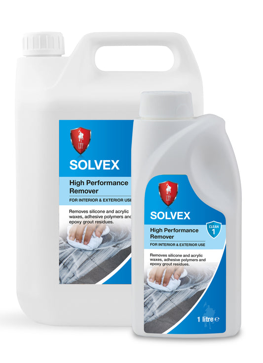 Two white plastic containers of SOLVEX High Performance Remover, one large and one small, with blue labels and a red shield logo—an effective epoxy grout remover and sealer remover designed for stone, silicone, waxes, adhesives, and grout residues.