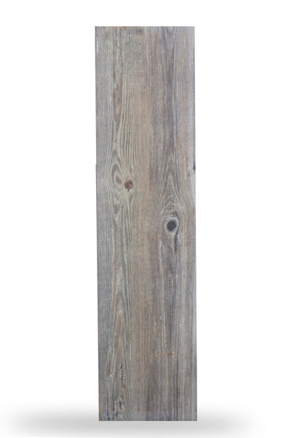 Rectangular wooden plank with a weathered gray-brown finish, showing natural wood grain patterns and knots, resembles an outdoor porcelain tile with a natural wood appearance, isolated on a white background.