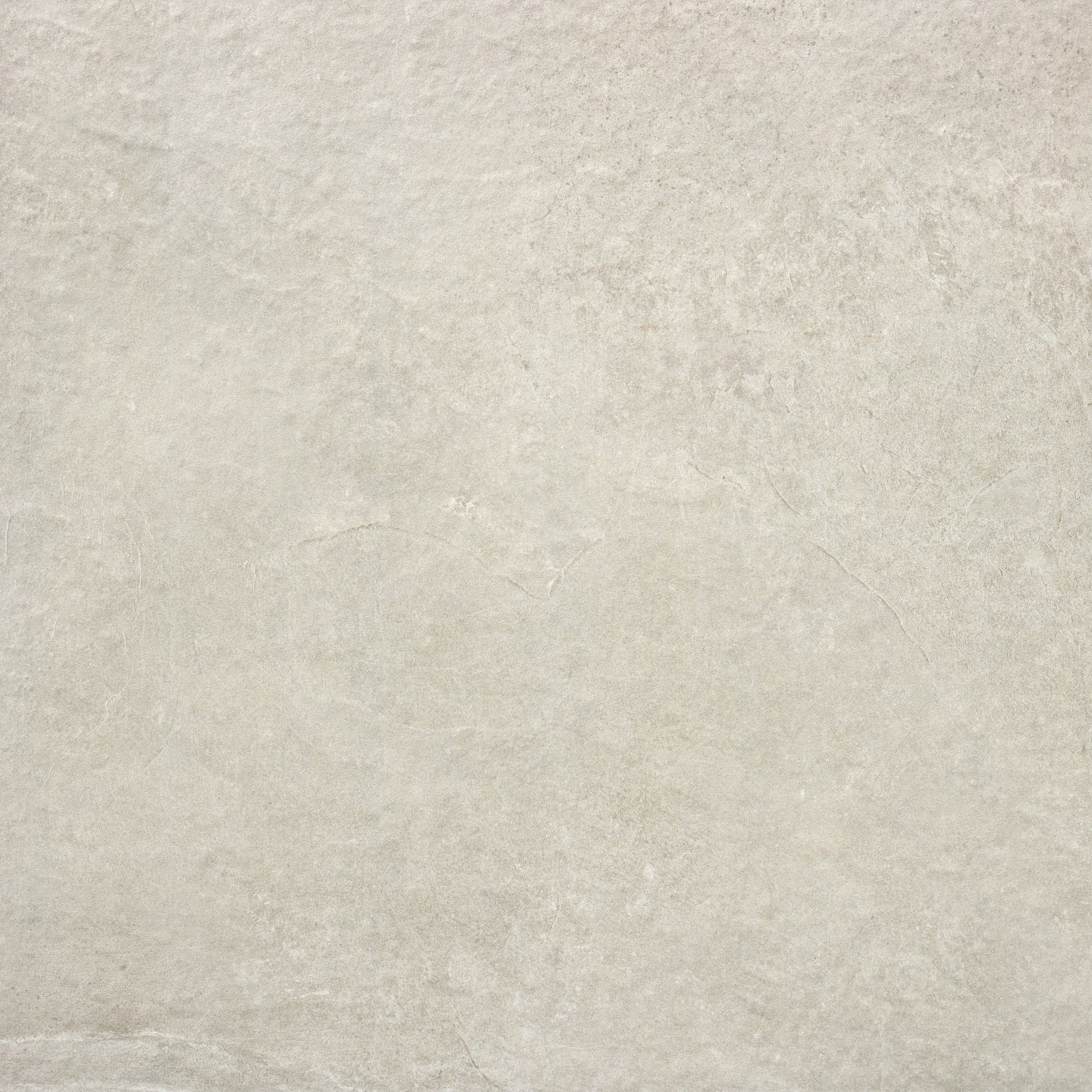 Light gray stone surface with subtle, natural texture and faint lines. The look is neutral and minimalistic, making it ideal for outdoor porcelain tiles like Palmer Bone Porcelain Paving Slabs, thanks to its smooth finish and gentle shading variations.