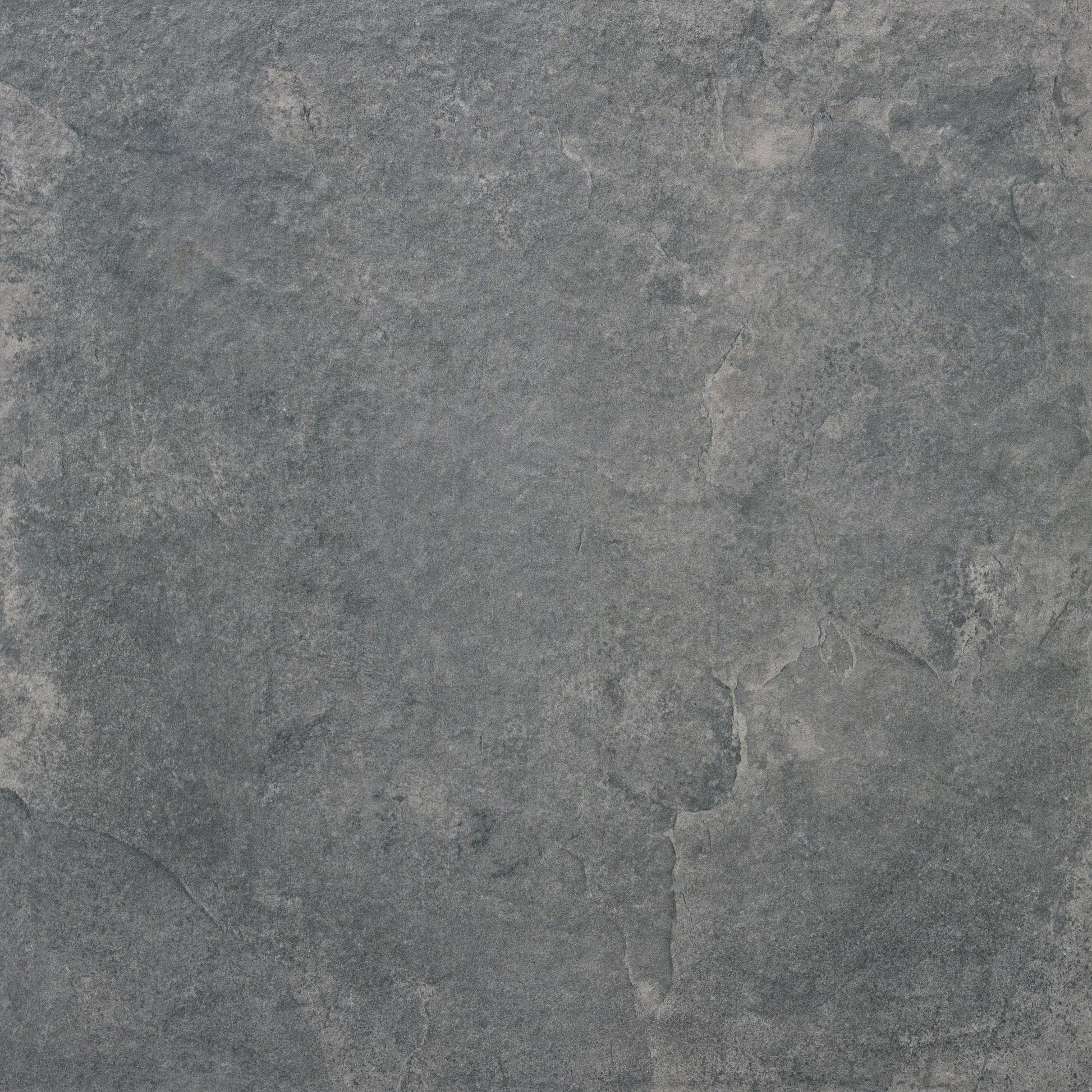 A close-up view of a textured gray stone surface with subtle color variations, cracks, and natural patterns, reminiscent of Palmer Graphite Porcelain Paving Slabs.
